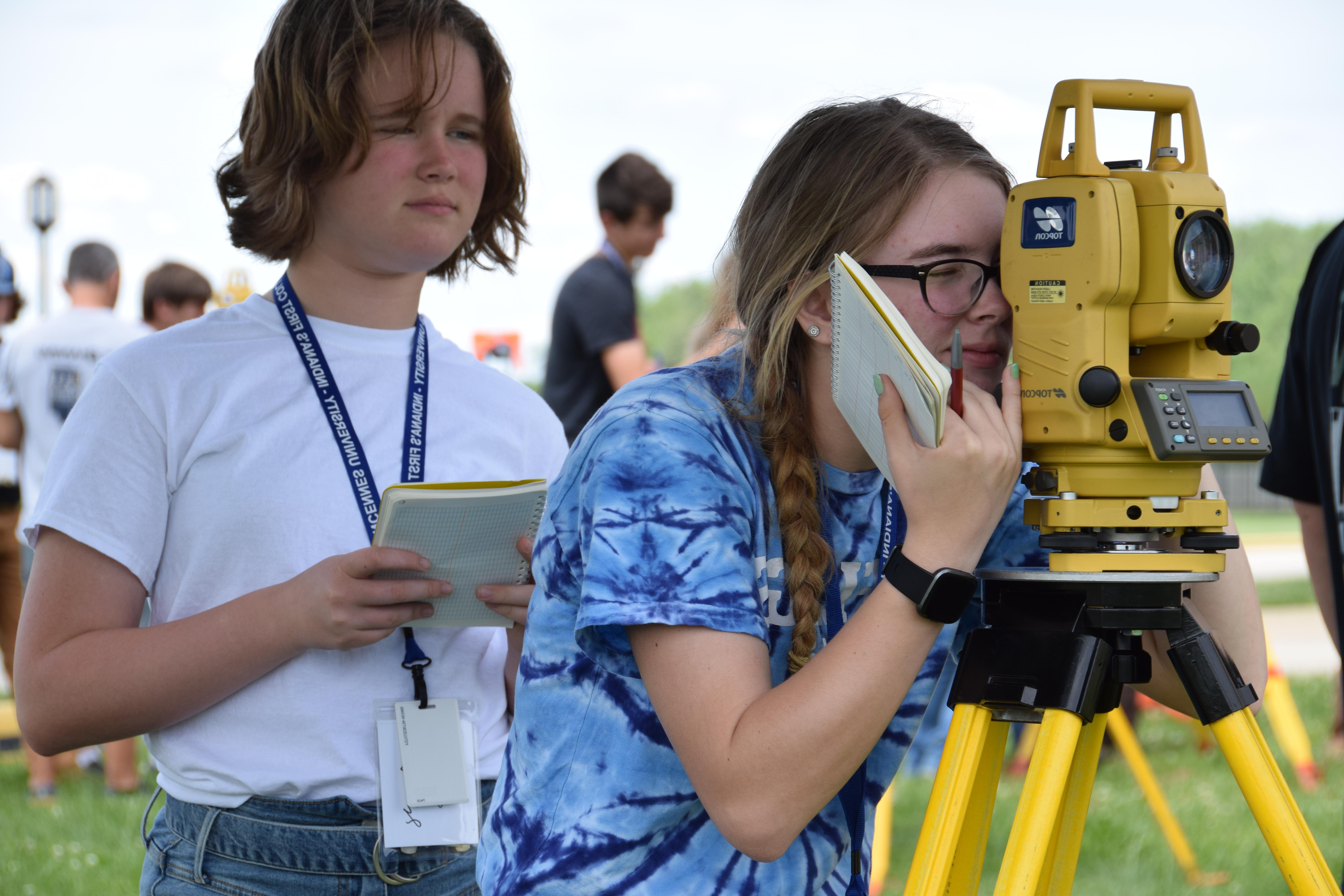 Two female campers learning to use electronic technology at Surveying Technology Summer Camp at Vincennes University